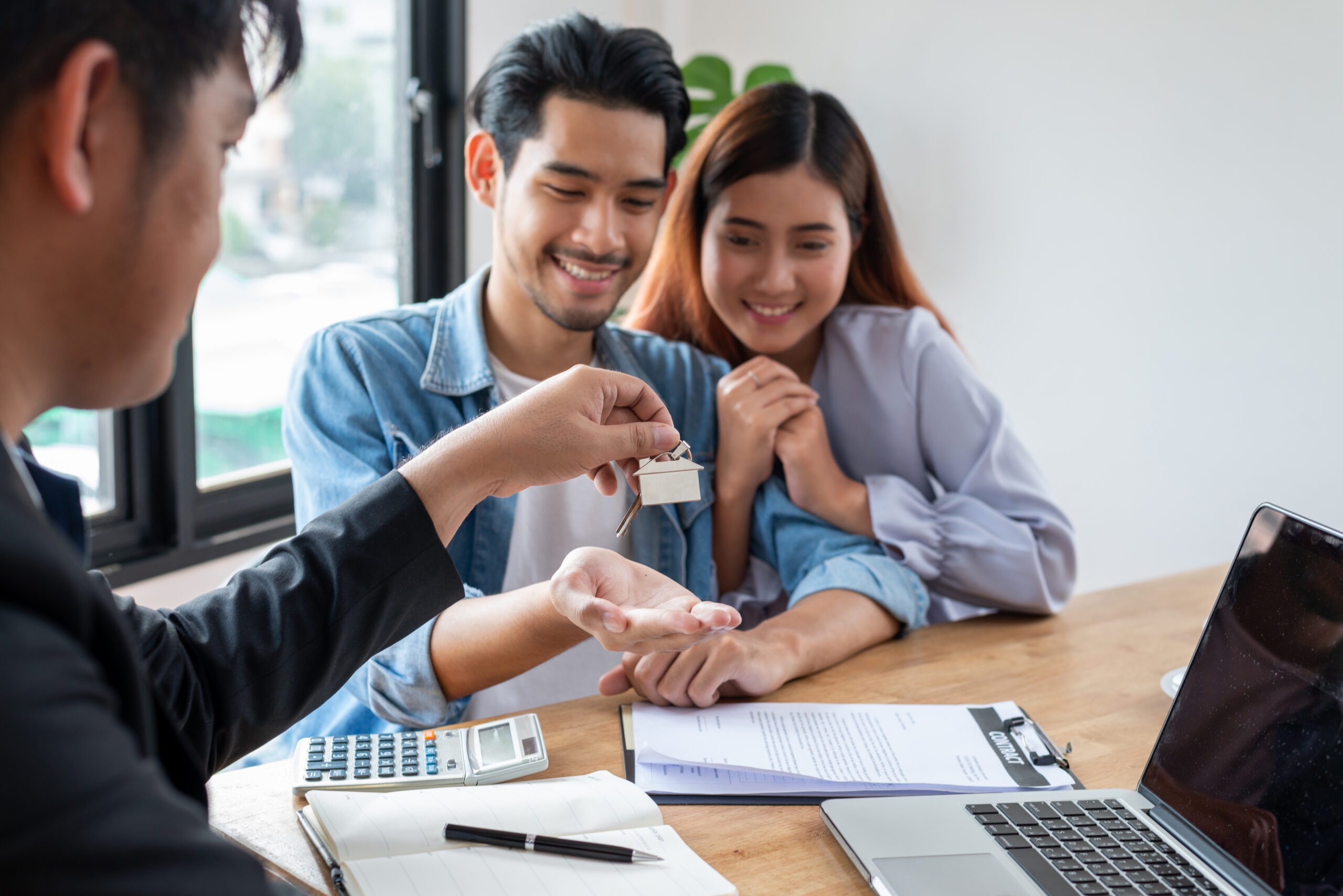 Young Asian Couple Feeling Happy After Finish Buying or Rental Real Estate With Agent