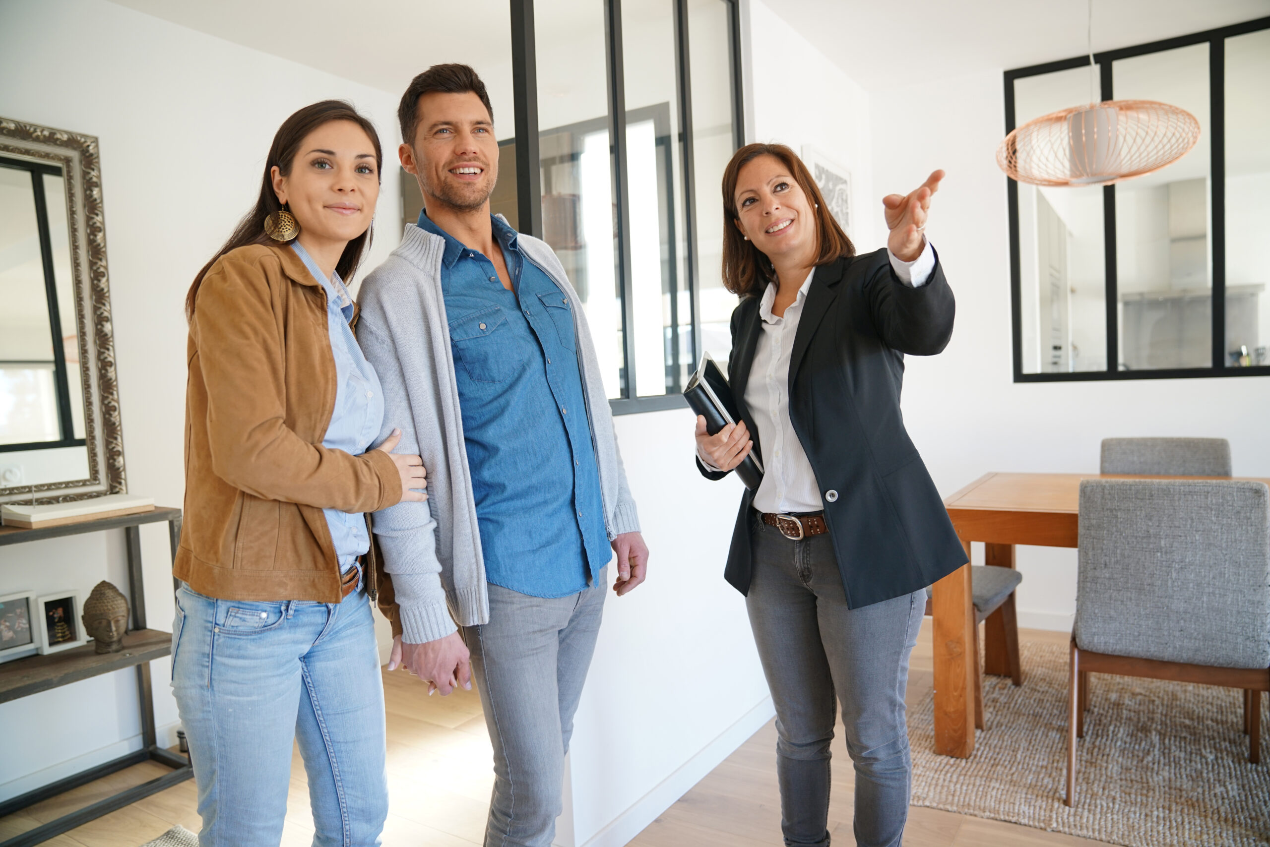Couple With Real-Estate Agent Visiting House for Sale